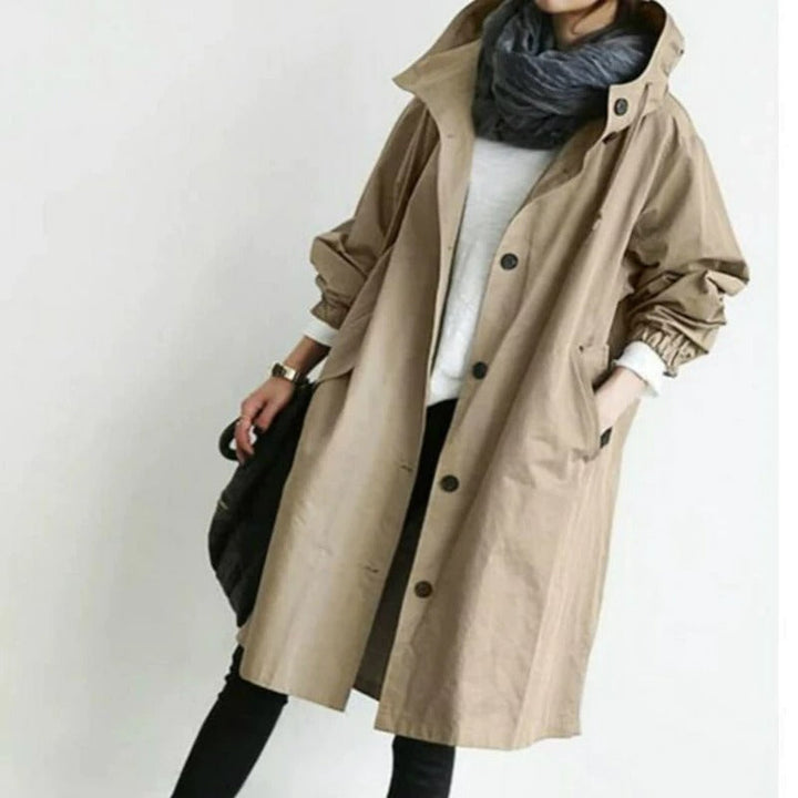 "Vattentät damjacka trenchcoat med modern design, elegant snitt och klassiska detaljer för vardagsbruk."