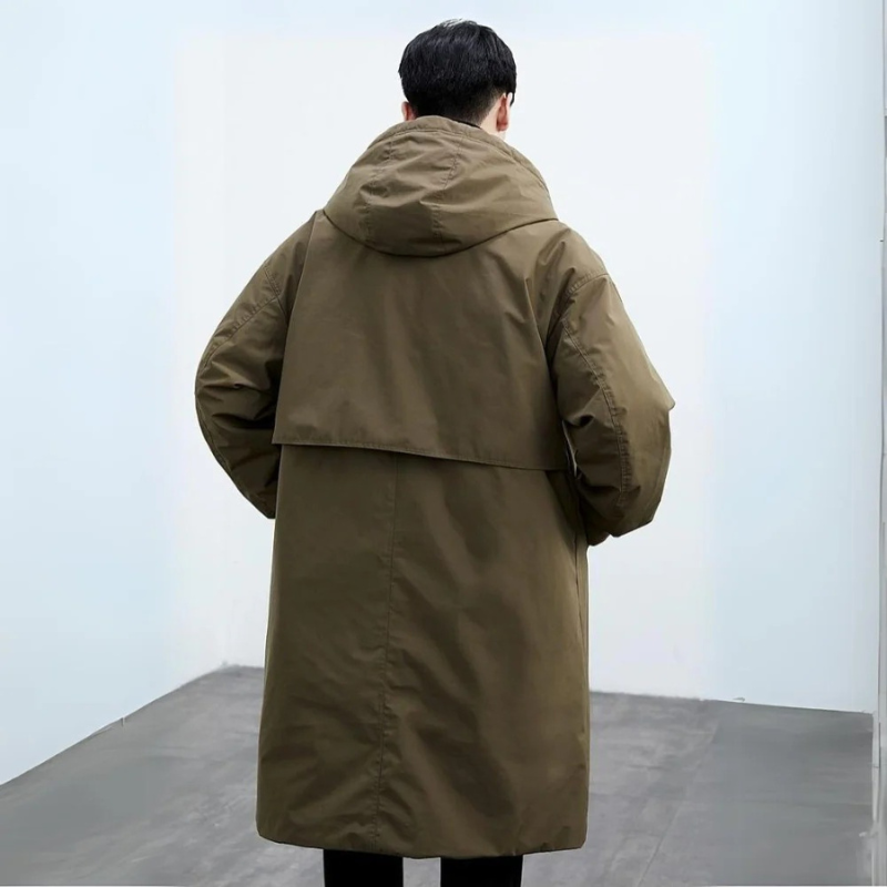 Vattentät pufferjacka trenchcoat för män, lång och elegant, perfekt för vintern, med stilfull design och värmande isolering.