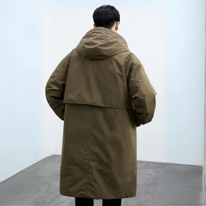 Vattentät pufferjacka trenchcoat för män, lång och elegant, perfekt för vintern, med stilfull design och värmande isolering.