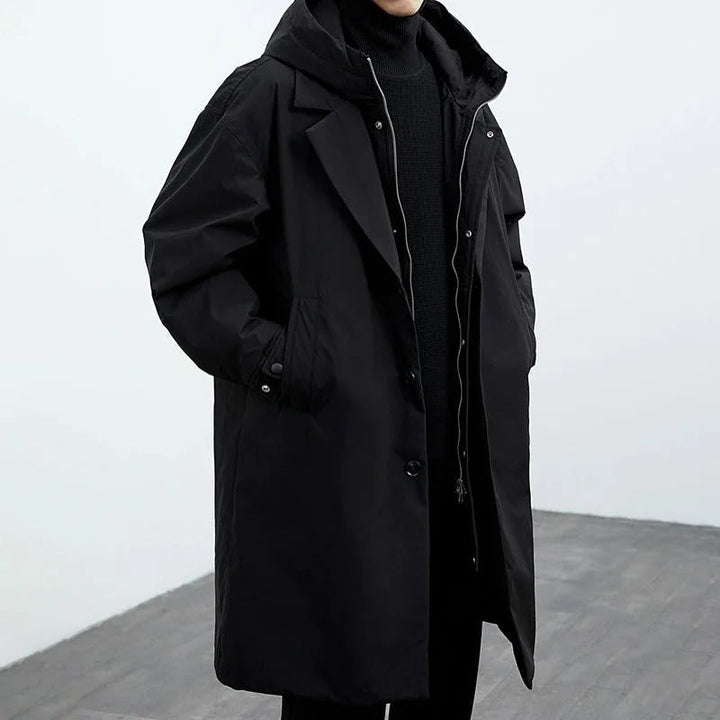 Vattentät pufferjacka trenchcoat för män, lång och elegant, perfekt för vintern, med stilfull design och värmande isolering.