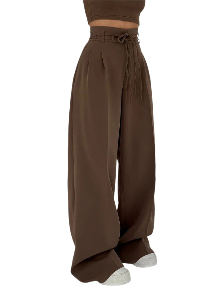 "Vida byxor dam hög midja, elegant passform med mjukt material och vita ben för en stilren och bekväm look."