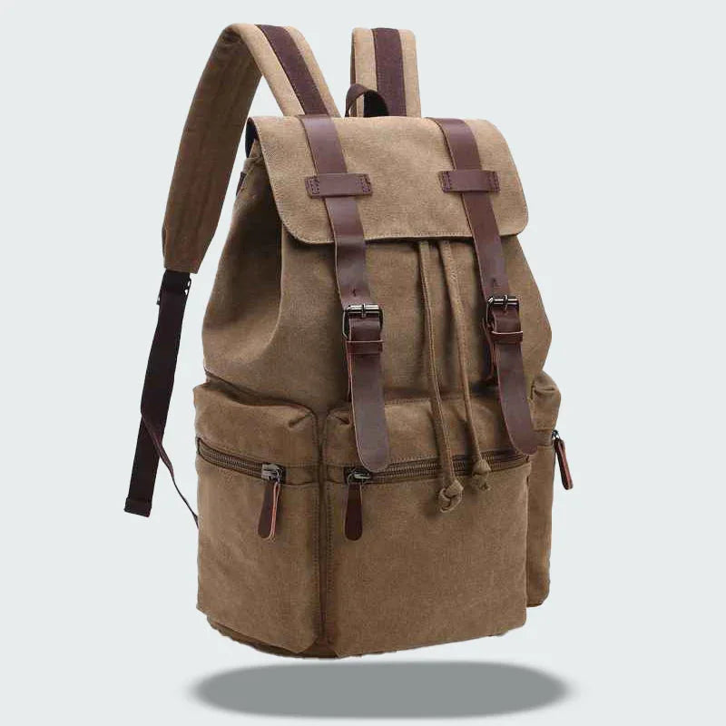 "Vintage herrryggsäck i slitstark canvas med läderdetaljer, lock och fickor, perfekt för vardag och äventyr."