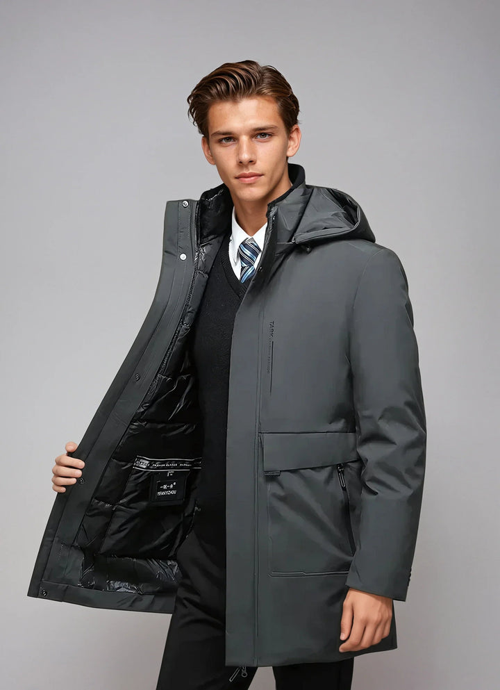 Vinter parka för herrar med huva och fickor, väderbeständigt material, stilren design, perfekt för kalla dagar.