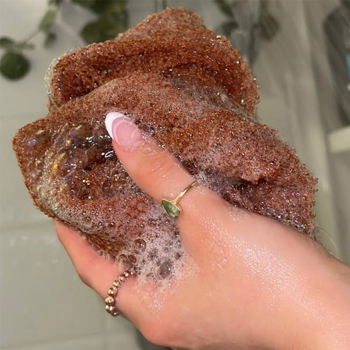 "Afrikanskt exfolieringsnät i nylon, blått, grovmaskigt för effektiv hudvård. Perfekt för hela kroppen, även svåråtkomliga om
