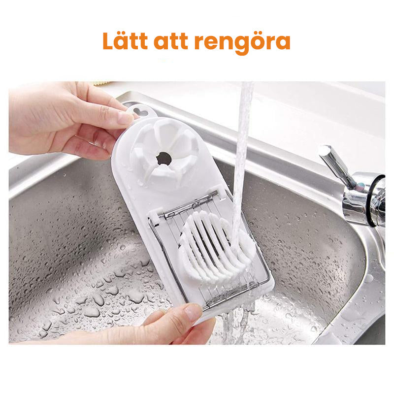 Äggskärare, vit och röd, av slitstarkt plast och rostfritt stål med dubbelkammardesign för skivning och klyvning.