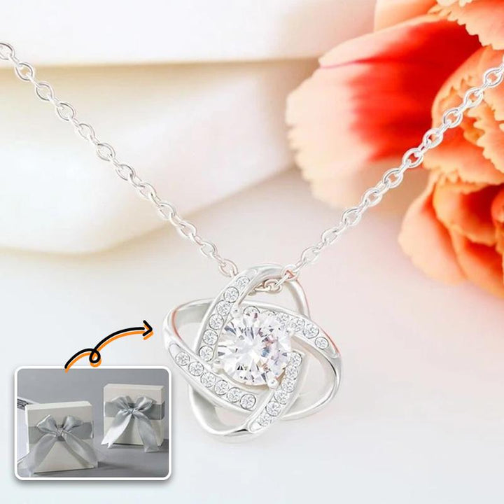 Ändlös Knytande Vänskapsring och halsband i silver, symboliserar evigt band; perfekt för kvinnor och speciella tillfällen.