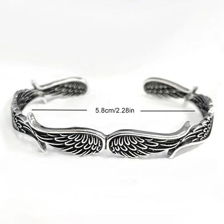 "Änglavingar armband i koppar vintagestil, unisex design, justerbar, symbol för skydd och mod, elegant och tidlös look."