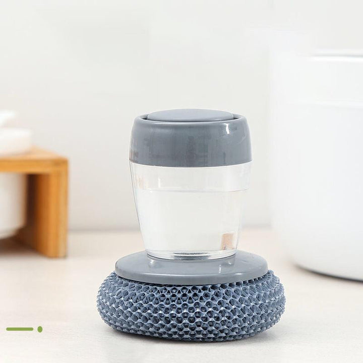 "Antibakteriell handflatansborste med inbyggd dispenser, rostfritt stålborst och ergonomisk design för effektiv köksrengöring
