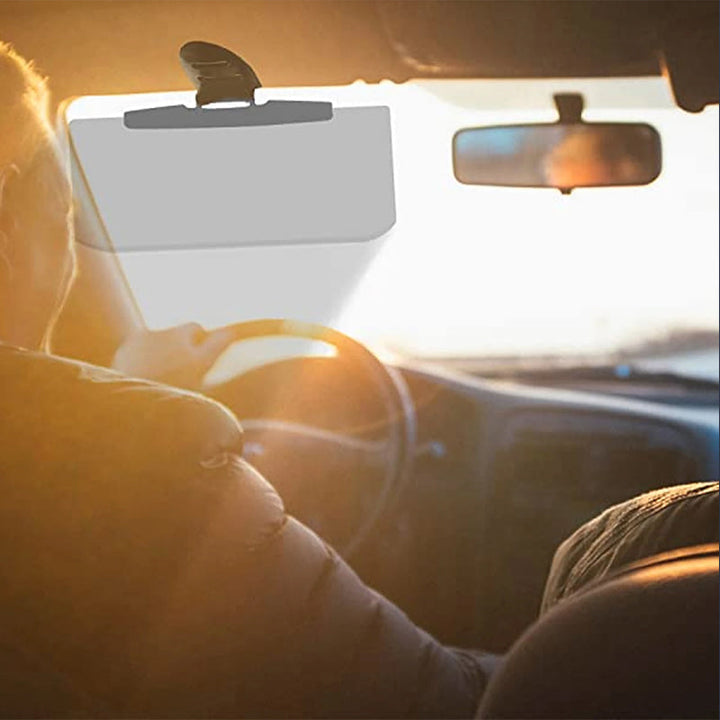 "Antireflex solskydd för bil, transparent design, blockerar solljus effektivt. Enkel installation för bättre sikt."