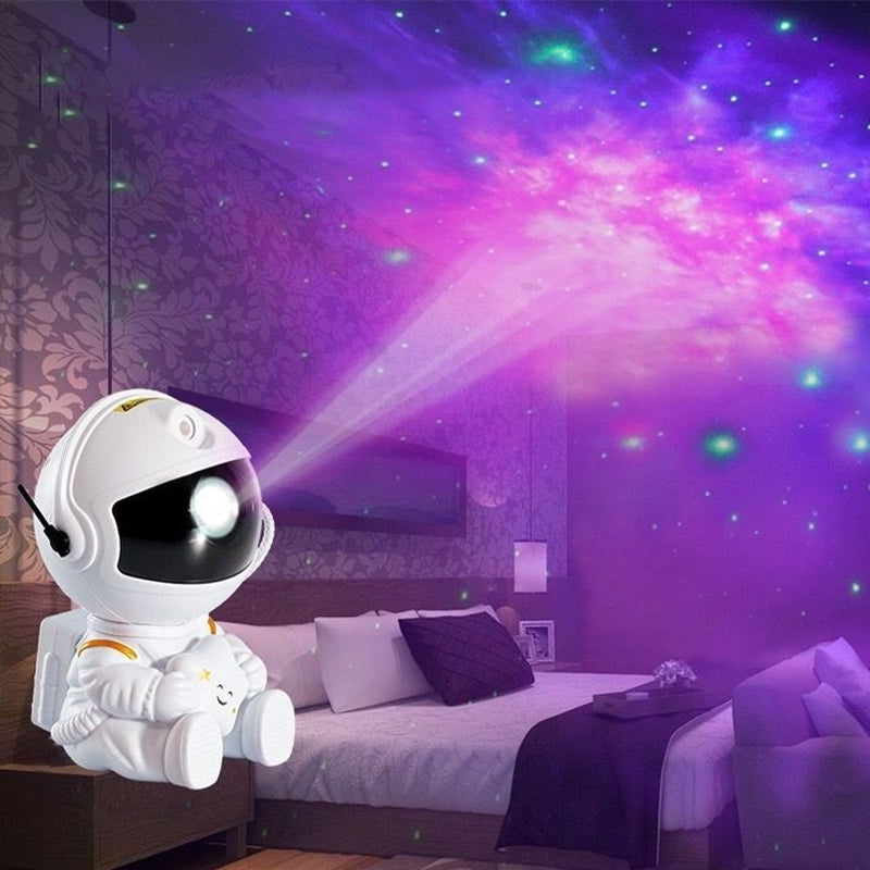 "Astronautprojektor för stjärnhimmel i rum, skapar en stjärnklar himmel, lugnande nattljus för avkoppling."