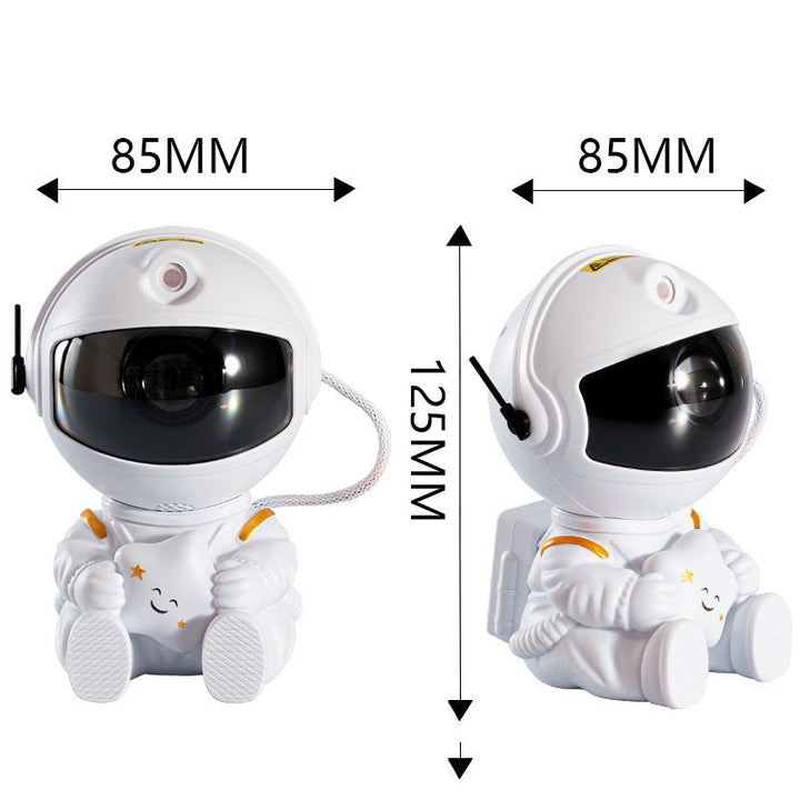 "Astronautprojektorlampa med stjärnhimmel, vit astronautfigur, projicerar 360° ljus och stjärnor i ett rum."