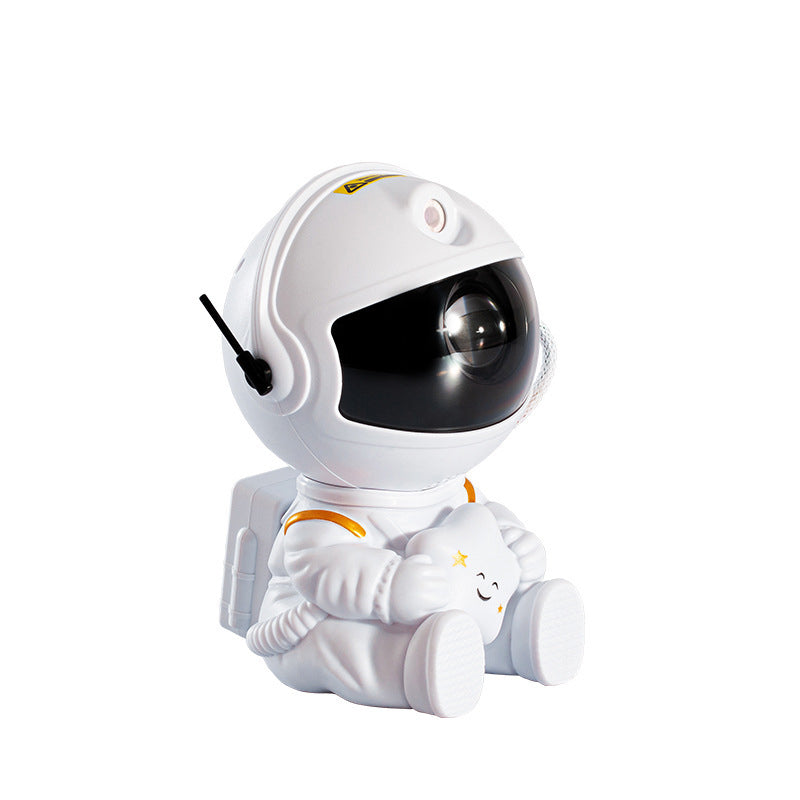 "Astronautprojektorlampa med stjärnhimmel, vit astronautfigur, projicerar 360° ljus och stjärnor i ett rum."