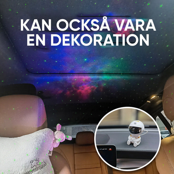 "Astronautprojektorlampa med stjärnhimmel, vit astronautfigur, projicerar 360° ljus och stjärnor i ett rum."