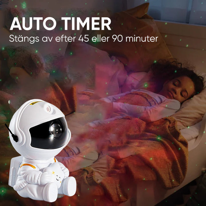 "Astronautprojektorlampa med stjärnhimmel, vit astronautfigur, projicerar 360° ljus och stjärnor i ett rum."