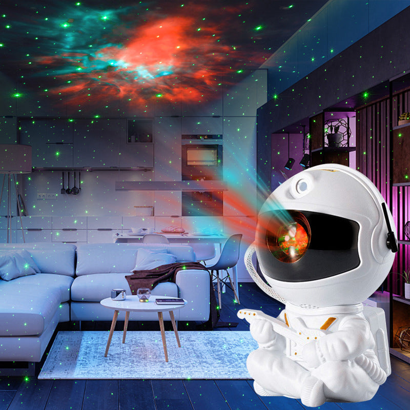 "Astronautprojektorlampa med stjärnhimmel, vit astronautfigur, projicerar 360° ljus och stjärnor i ett rum."