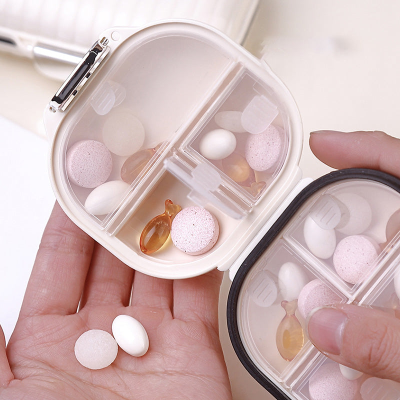 Bärbar daglig pillerlåda med 7 delar; kompakt, vit design i PET+silikon för organiserad medicinhantering.