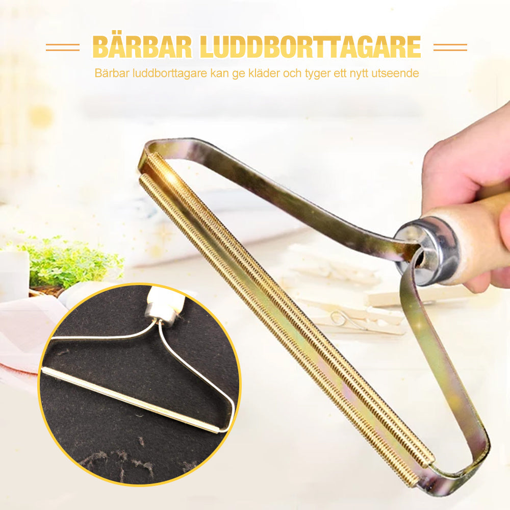 Bärbar luddborttagare för kläder och tyger, elegant och kompakt, avlägsnar ludd effektivt och batterifritt.