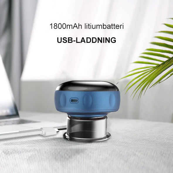 Bärbar massageapparat för koppning med rödljus, kompakt design och dynamisk sugteknik för individuell massage och ljusterapi.