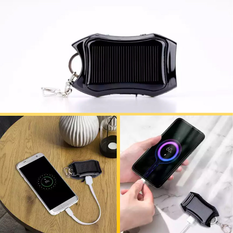 Bärbar mini powerbank på nyckelring, svart och vit, kompakt design, perfekt för resor och enkel att bära med sig.