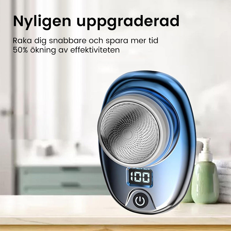 "Bärbar Mini Rakapparat för Män i blå/silver, kompakt design med rostfria blad och kraftfull motor, lämplig för resor."
