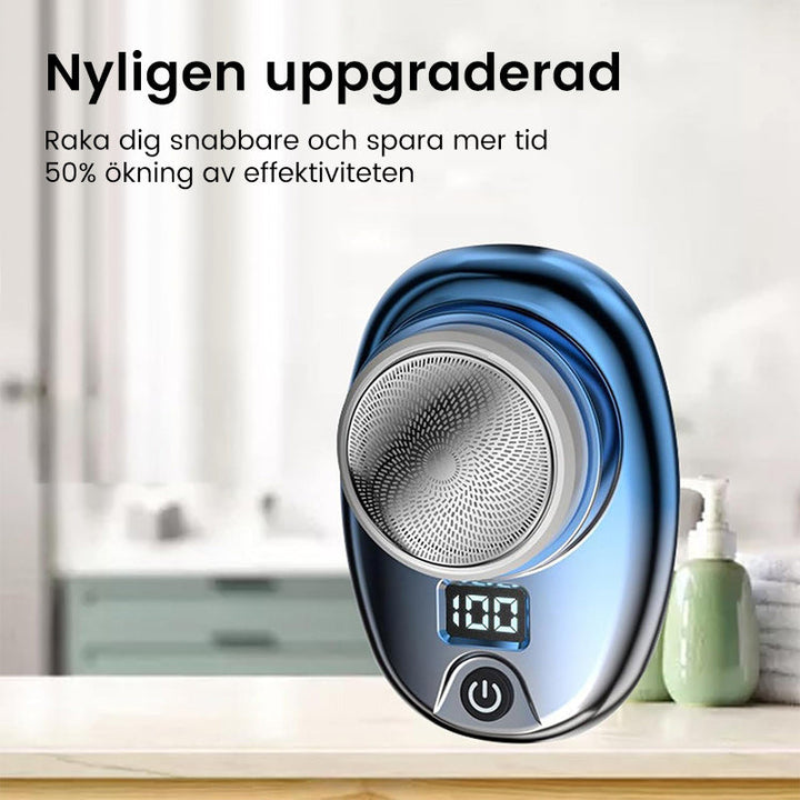 "Bärbar Mini Rakapparat för Män i blå/silver, kompakt design med rostfria blad och kraftfull motor, lämplig för resor."