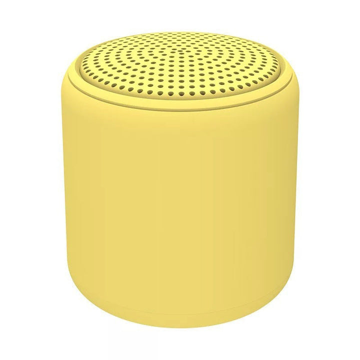 "Bärbar trådlös Bluetooth-högtalare i macaroon-färg med modern design, kompakt och lätt, perfekt för resor och hemmet."