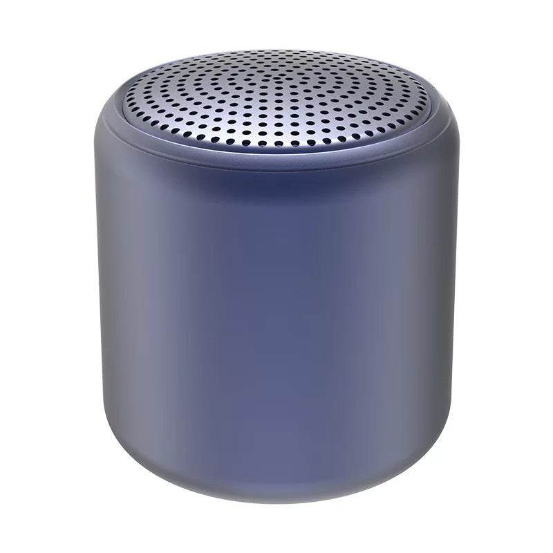 "Bärbar trådlös Bluetooth-högtalare i macaroon-färg med modern design, kompakt och lätt, perfekt för resor och hemmet."