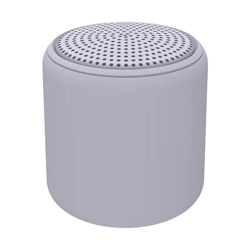 "Bärbar trådlös Bluetooth-högtalare i macaroon-färg med modern design, kompakt och lätt, perfekt för resor och hemmet."