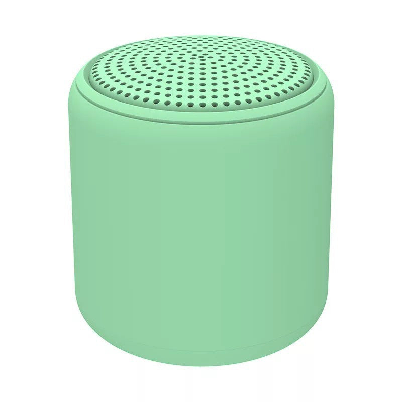 "Bärbar trådlös Bluetooth-högtalare i macaroon-färg med modern design, kompakt och lätt, perfekt för resor och hemmet."