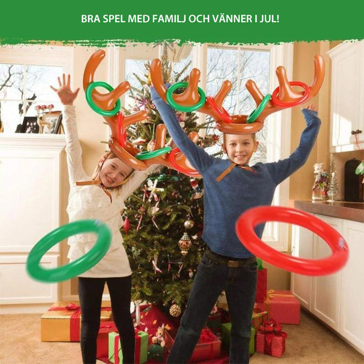 "Barn uppblåsbart ringkastningsspel med färgglada renhorn och kastringar för festlig jullek, perfekt för familjer."