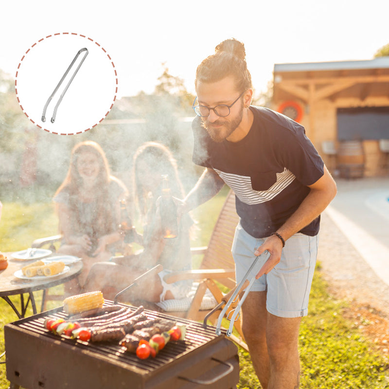 "BBQ-tänger i rostfritt stål med ergonomisk design och justerbar rörelse, perfekta för säker och effektiv grillning."