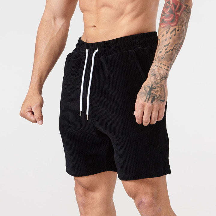 "Beige corduroy herrshorts med dragsko, avslappnad passform; mjuk bomullsmanchester perfekt för sommarutflykter."