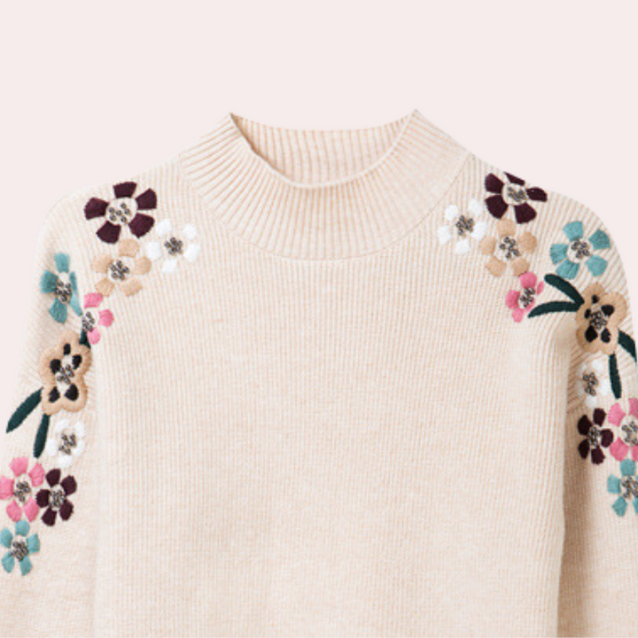 Damtröja med detaljerat blommönster. Bekväm och varm stickad pullover, perfekt för kyliga höstdagar.