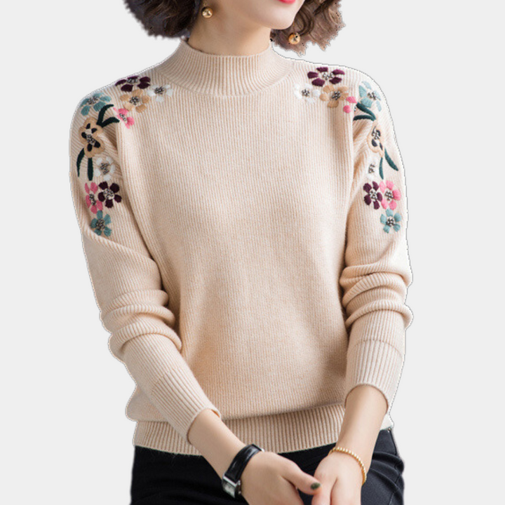 Trendig damtröja med blommig design. Långärmad pullover för höst och vinter, perfekt för kvinnors mode.
