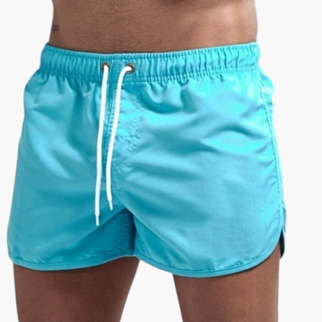 Herrbadshorts för sommar & fritid. Bekväma, justerbara badkläder perfekta för strand, pool eller avkoppling.