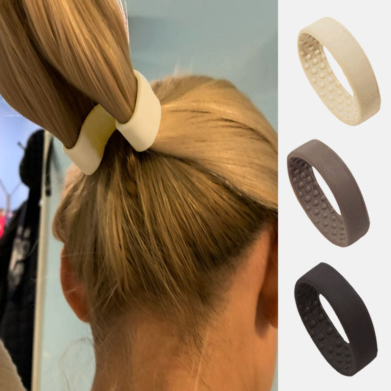 "Bekvämt vikbart silikonhårband för damer, elastiskt, hållbart, svart färg mot vit bakgrund."