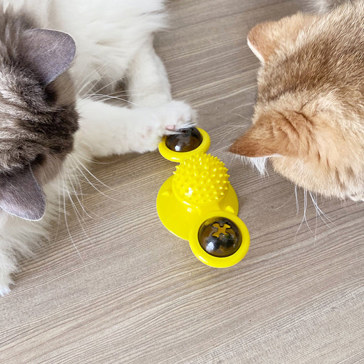 "Blå interaktiv väderkvarn kattleksak med genomskinliga behållare och gummiplexus i mitten på vit bakgrund."