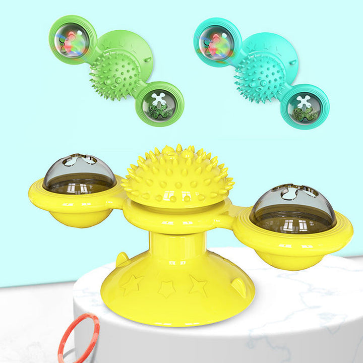 "Blå interaktiv väderkvarn kattleksak med genomskinliga behållare och gummiplexus i mitten på vit bakgrund."