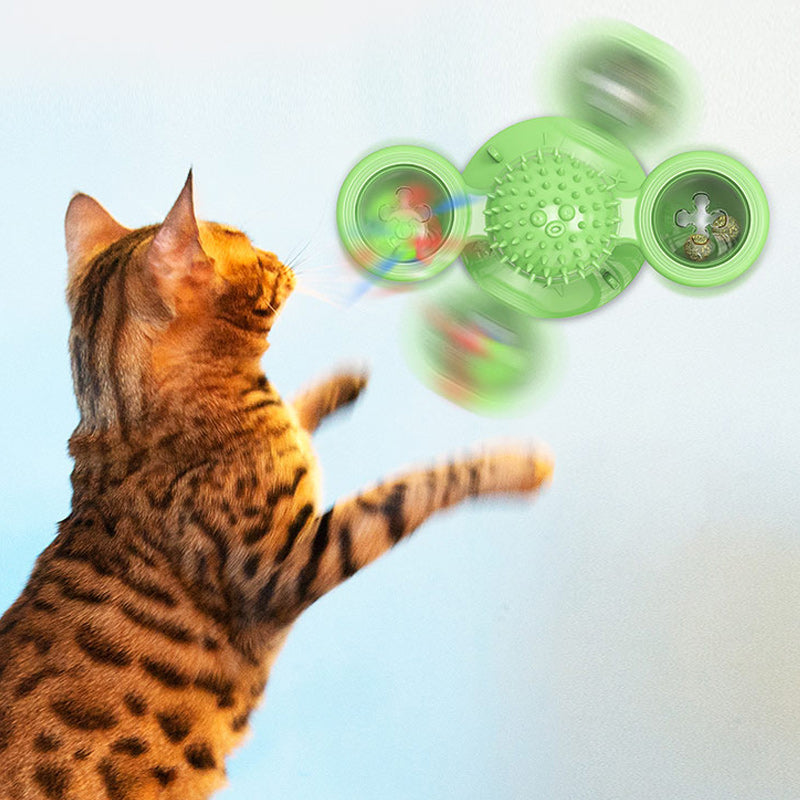 "Blå interaktiv väderkvarn kattleksak med genomskinliga behållare och gummiplexus i mitten på vit bakgrund."