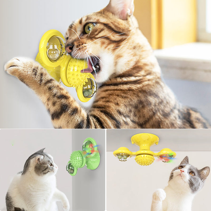 "Blå interaktiv väderkvarn kattleksak med genomskinliga behållare och gummiplexus i mitten på vit bakgrund."