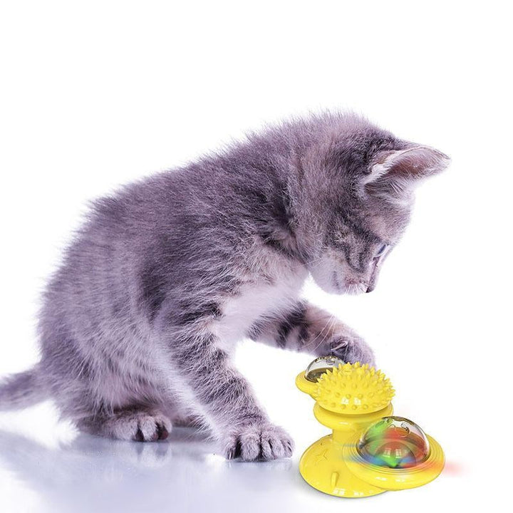 "Blå interaktiv väderkvarn kattleksak med genomskinliga behållare och gummiplexus i mitten på vit bakgrund."