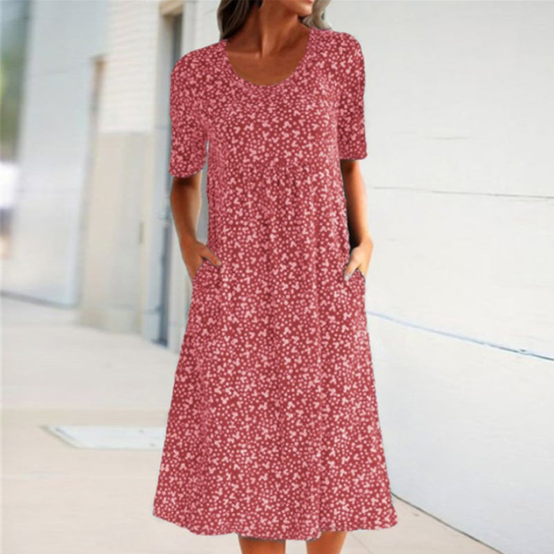 "Blommig dam midi klänning, rund hals, kort ärm, vår/sommar, feminin design, bekväm passform."