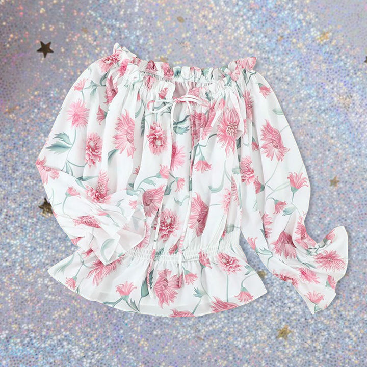 Blommig off shoulder volangblus dam med puffärmar i chiffong. Elegant och feminin topp för stilmedvetna kvinnor.