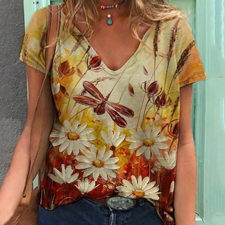 "Blommig V-ringad dam t-shirt i mjuk bomullsblandning med blomsterprint, kortärmad och modern design för vardagsbruk."