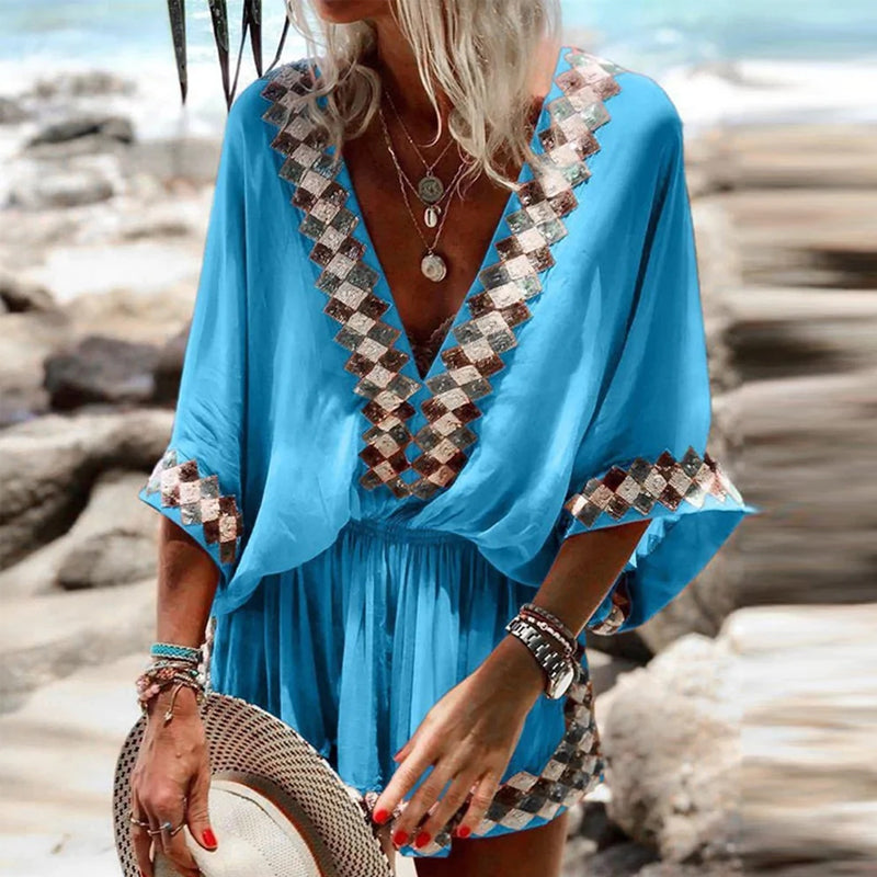 "Boho jumpsuit för kvinnor i polyester med tryckt mönster, kort ärm och lös passform, perfekt för sommar och strand."