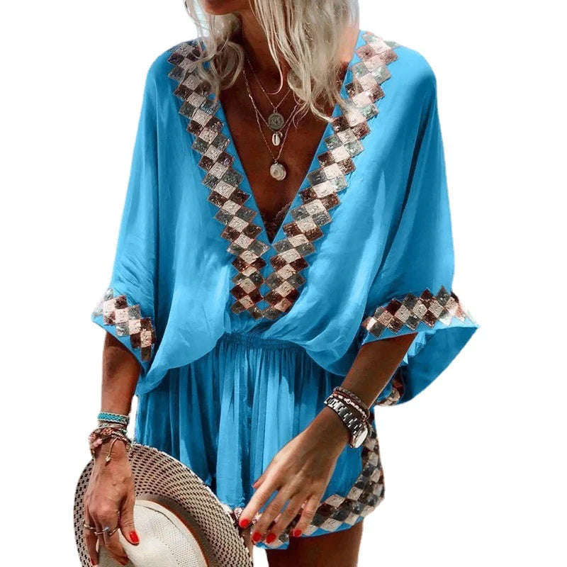 "Boho jumpsuit för kvinnor i polyester med tryckt mönster, kort ärm och lös passform, perfekt för sommar och strand."