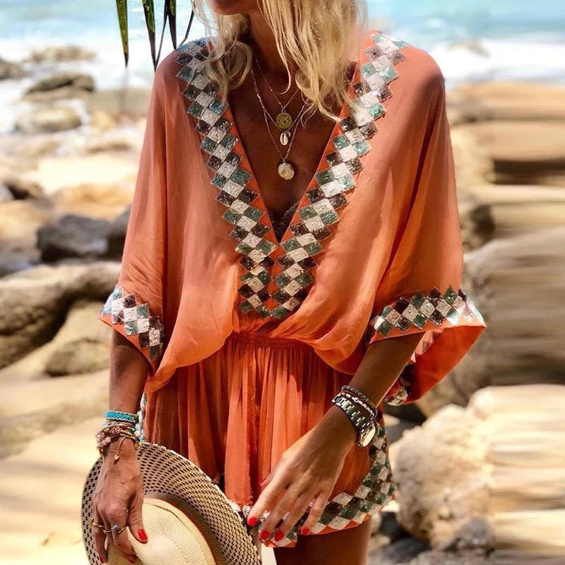 "Boho jumpsuit för kvinnor i polyester med tryckt mönster, kort ärm och lös passform, perfekt för sommar och strand."