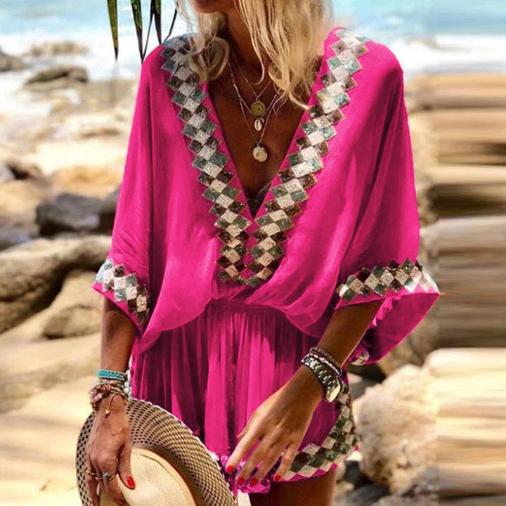 "Boho jumpsuit för kvinnor i polyester med tryckt mönster, kort ärm och lös passform, perfekt för sommar och strand."