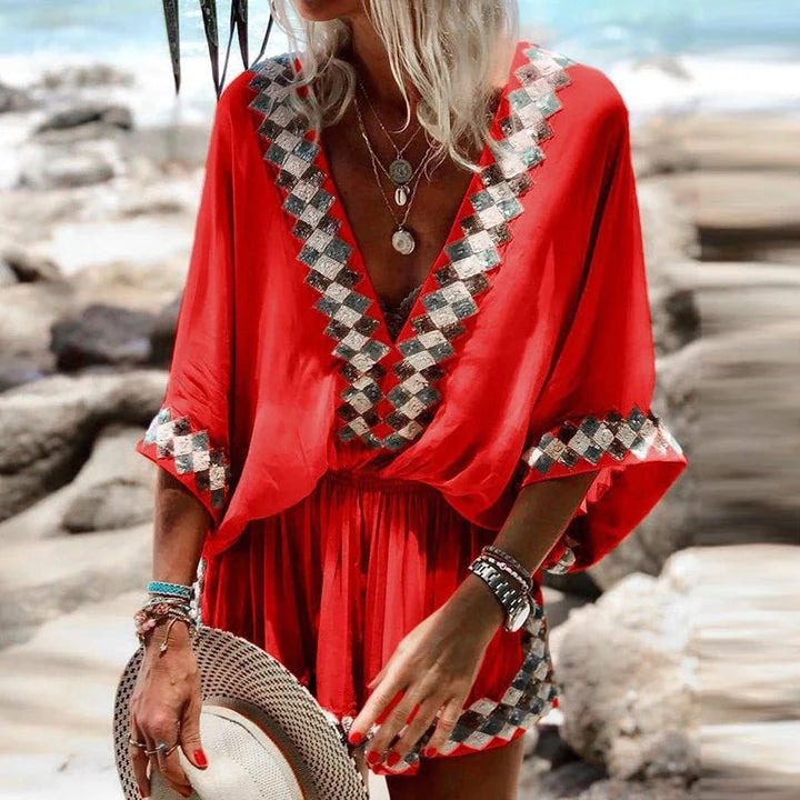 "Boho jumpsuit för kvinnor i polyester med tryckt mönster, kort ärm och lös passform, perfekt för sommar och strand."