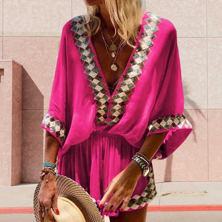 "Boho jumpsuit för kvinnor i polyester med tryckt mönster, kort ärm och lös passform, perfekt för sommar och strand."